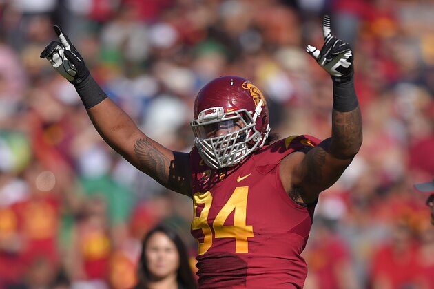 Southern California defensive end Leonard Williams gestures to fans during the first half an NCAA college football game against Notre Dame, Saturday, Nov. 29, 2014, in Los Angeles. Southern California won 49-14. (AP Photo/Mark J. Terrill)