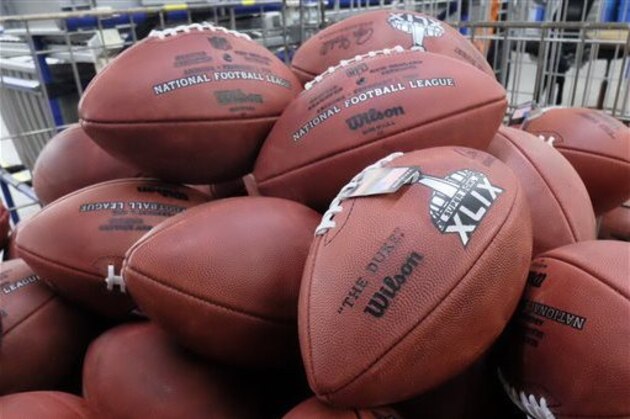 Official game balls for NFL football's Super Bowl XLIX wait for final inspection at the Wilson Sporting Goods Co. in Ada, Ohio, Tuesday, Jan. 20, 2015. The New England Patriots face the Seattle Seahawks for the NFL championship on Sunday, Feb. 1, 2015,  in Glendale, Ariz. (AP Photo/Rick Osentoski)