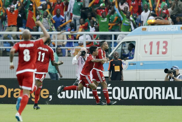 Equatorial Guinea's Emilio Nsue, right, celebrates with teammates after scoring a goal during the opening African Cup of Nations Group A soccer match between Equatorial Guinea and Congo, in Bata, Equatorial Guinea, Saturday, Jan. 17, 2015. (AP Photo/Themba Hadebe)