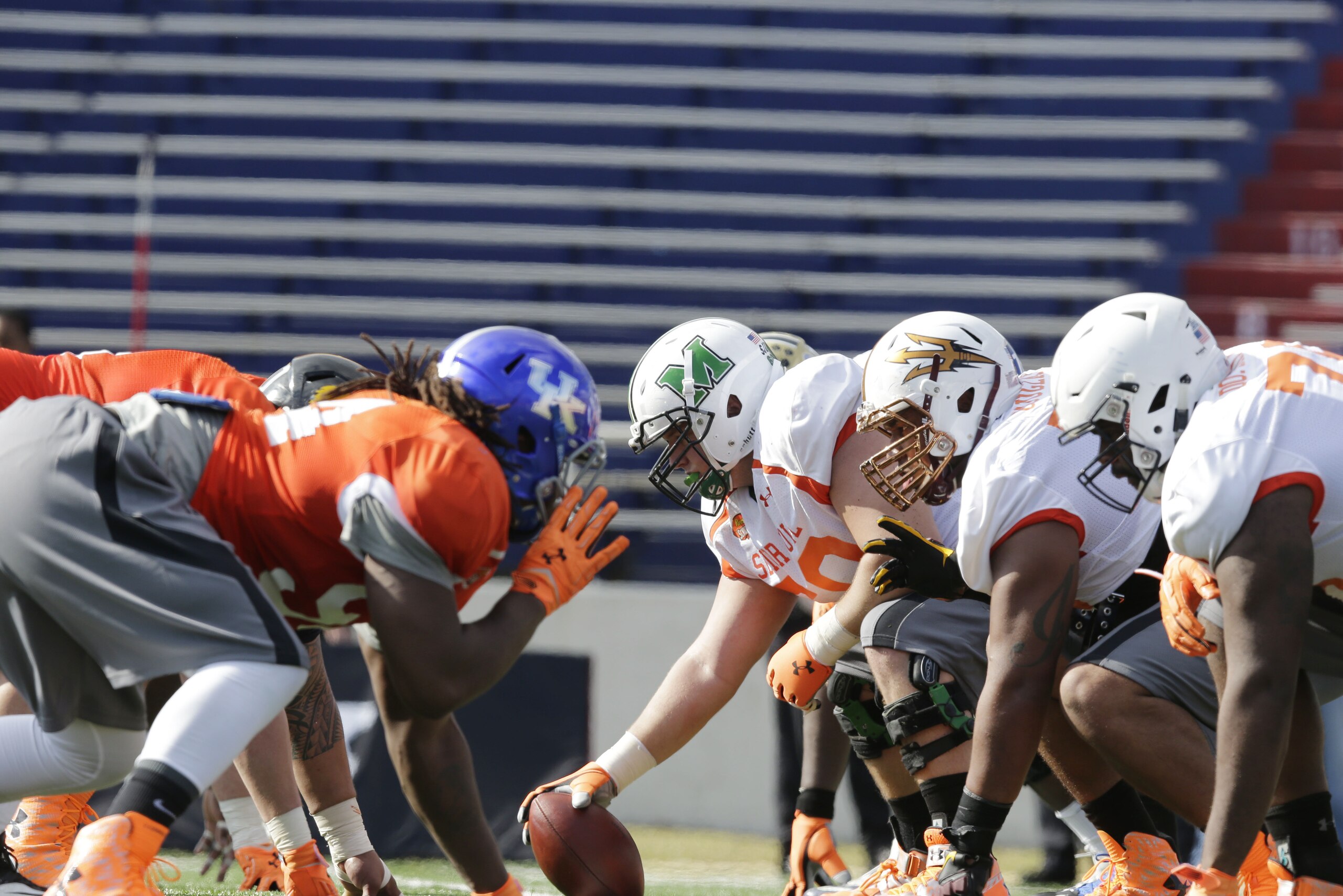 Senior Bowl players line to run through a drill during NCAA college football practice for the Senior Bowl, Tuesday, Jan. 20, 2015, at Ladd-Peebles Stadium in Mobile, Ala. (AP Photo/Brynn Anderson)