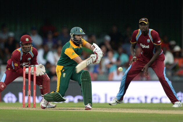 EAST LONDON, SOUTH AFRICA - JANUARY 21: Hashim Amla of South Africa hits the winning runs off Chris Gayle during the 3rd Momentum ODI between South Africa and West Indies at Buffalo Park on January 21, 2015 in East London, South Africa. (Photo by Duif du Toit/Gallo Images)