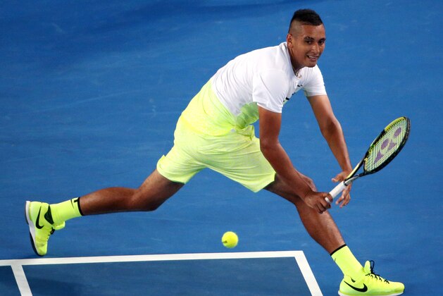 Nick Kyrgios of Australia plays a shot to Federico Delbonis of Argentina during their first round match at the Australian Open tennis championship in Melbourne, Australia, Monday, Jan. 19, 2015. (AP Photo/Rob Griffith)