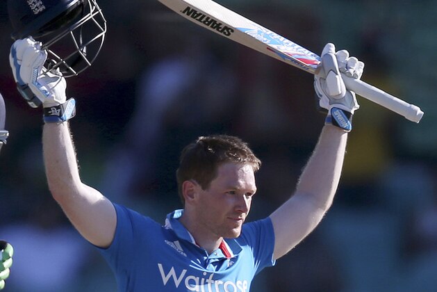 England's Eoin Morgan celebrates after making 100 runs against Australia during their One Day International cricket match in Sydney, Friday, Jan. 16, 2015. (AP Photo/Rick Rycroft)