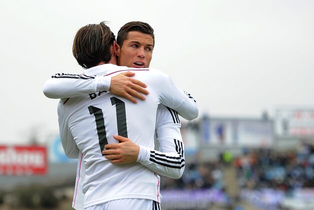 GETAFE, SPAIN - JANUARY 18:  Gareth Bale of Real Madrid celebrates with Cristiano Ronaldo after scoring his team's 2nd goal during the La Liga match between Getafe CF and Real Madrid CF at Coliseum Alfonso Perez stadium on January 18, 2015 in Getafe, Spain.  (Photo by Denis Doyle/Getty Images)