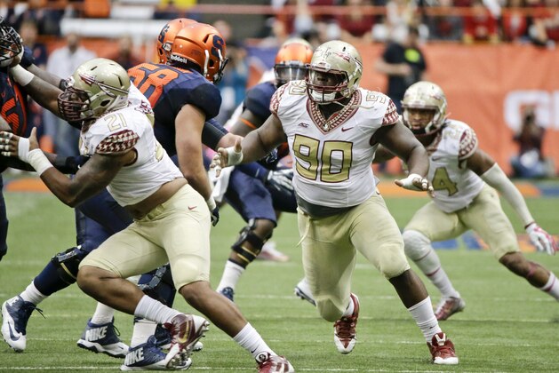 Florida State defensive tackle Eddie Goldman (90) rushes the passer during the second half of an NCAA college football game against the Syracuse Saturday, Oct. 11, 2014, in Syracuse, N.Y. Florida State won the game 38-20. (AP Photo/Frank Franklin II)