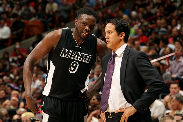 MIAMI, FL - JANUARY 20: Luol Deng #9 and Erik Spoelstra of the Miami Heat speak during a game against the Oklahoma City Thunder on January 20, 2015 at American Airlines Arena in Miami, Florida. NOTE TO USER: User expressly acknowledges and agrees that, by downloading and or using this Photograph, user is consenting to the terms and conditions of the Getty Images License Agreement. Mandatory Copyright Notice: Copyright 2015 NBAE (Photo by Isaac Baldizon/NBAE via Getty Images)