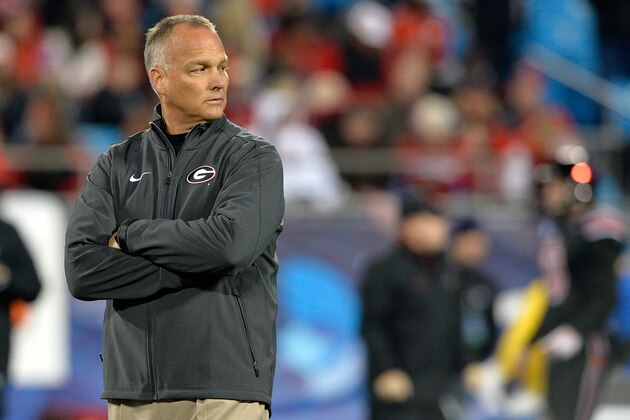 CHARLOTTE, NC - DECEMBER 30:  Head coach Mark Richt of the Georgia Bulldogs  watches his team warm up before a game against the Louisville Cardinals during the Belk Bowl at Bank of America Stadium on December 30, 2014 in Charlotte, North Carolina.  (Photo by Grant Halverson/Getty Images)