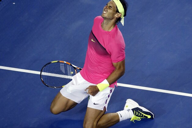 Rafael Nadal of Spain celebrates after defeating Tim Smyczek of the U.S. during their second round match at the Australian Open tennis championship in Melbourne, Australia, Wednesday, Jan. 21, 2015. (AP Photo/Vincent Thian)
