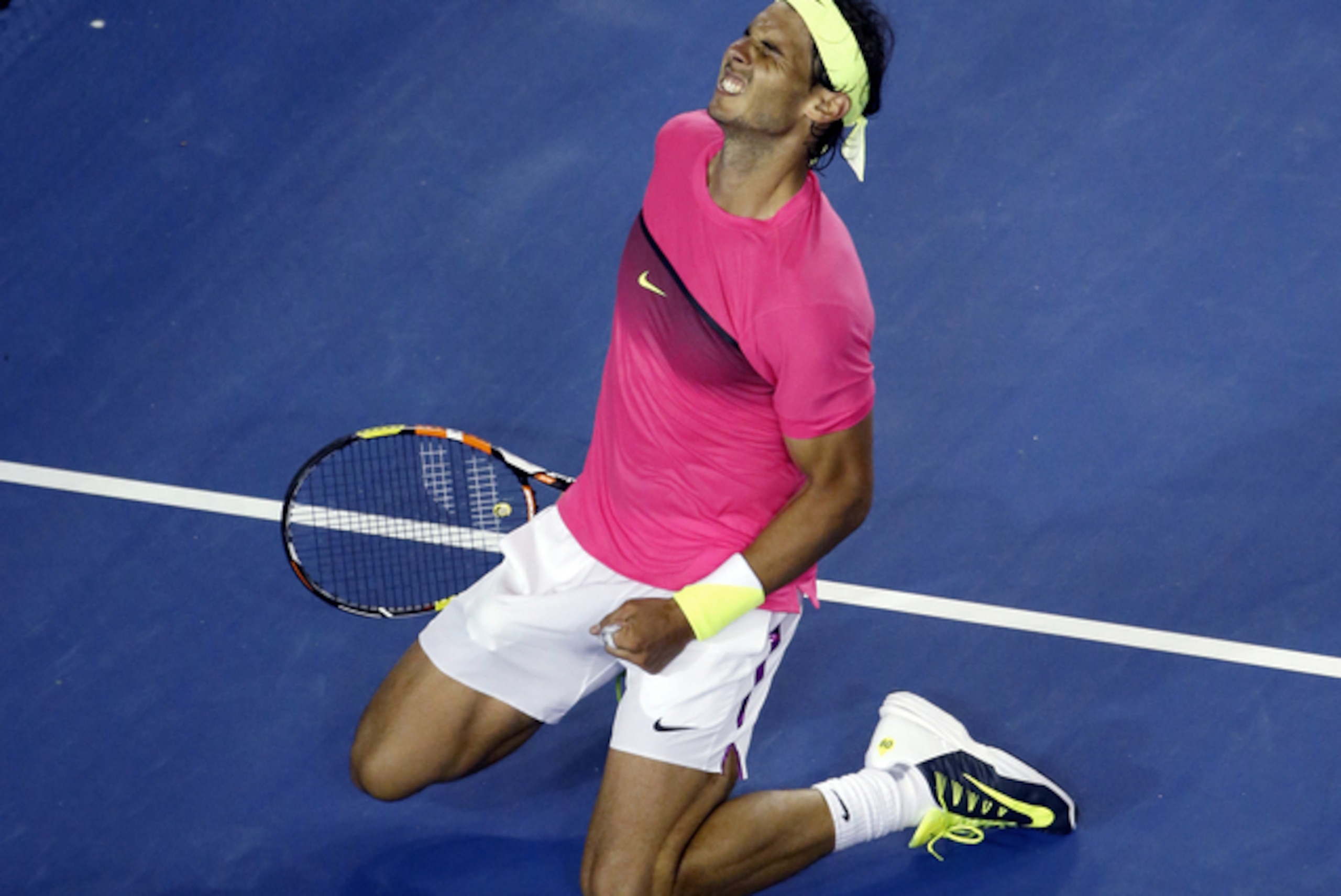 Rafael Nadal of Spain celebrates after defeating Tim Smyczek of the U.S. during their second round match at the Australian Open tennis championship in Melbourne, Australia, Wednesday, Jan. 21, 2015. (AP Photo/Vincent Thian)
