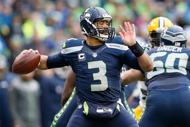 SEATTLE, WA - JANUARY 18:  Quarterback Russell Wilson #3 of the Seattle Seahawks throws a pass during the 2015 NFC Championship game against the Green Bay Packers at CenturyLink Field on January 18, 2015 in Seattle, Washington. The Seahawks defeated the Packers 28-22 in overtime.  (Photo by Christian Petersen/Getty Images)