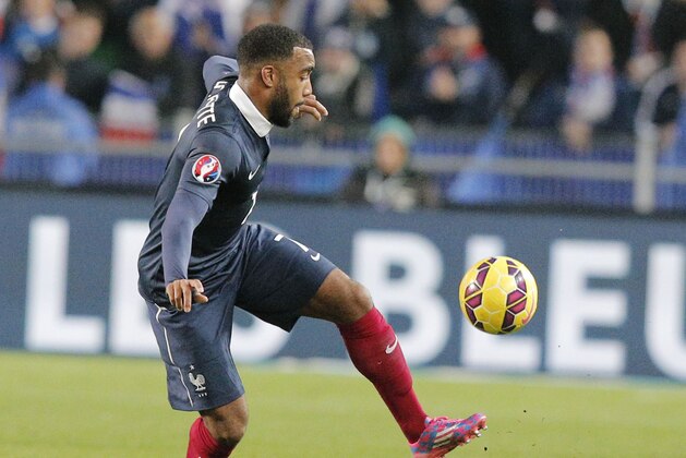 France's Alexandre Lacazette, controls the ball, during a friendly soccer match France against Albania at Route de Lorient stadium in Rennes, western France, Friday, Nov. 14, 2014. The match ended in a 1-1 draw. (AP Photo/Michel Euler)