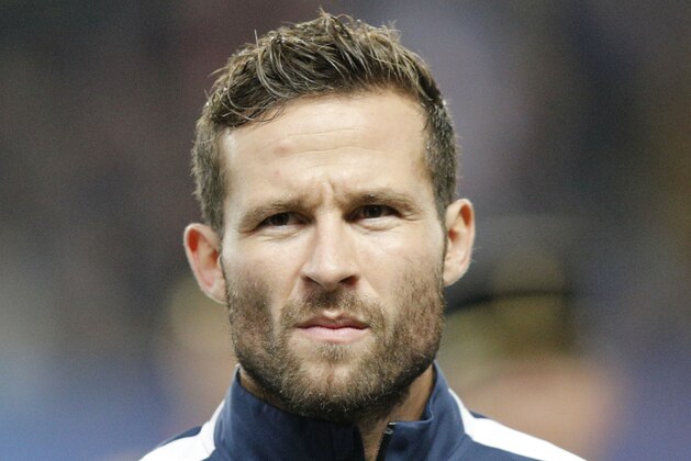 France's Yohan Cabaye, stands at attention during the Albanian National anthem prior to the start of a friendly soccer match France against Albania at Route de Lorient stadium in Rennes, western France, Friday, Nov. 14, 2014. The match ended in a 1-1 draw. (AP Photo/Michel Euler)