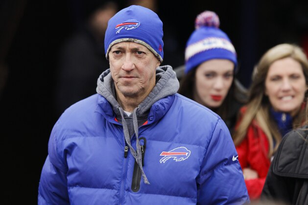 Former Buffalo Bills quarterback Jim Kelly walks toward the field at Ralph Wilson Stadium up before an NFL football game between the Buffalo Bills and the Green Bay Packers Sunday, Dec. 14, 2014, in Orchard Park, N.Y.  (AP Photo/Bill Wippert)