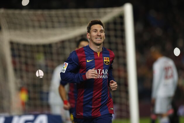Barcelona's Lionel Messi, from Argentina, celebrates scoring the opening goal during a Copa del Rey Quarterfinal soccer match between FC Barcelona and Atletico Madrid, at the Camp Nou stadium in Barcelona, Spain, Wednesday, Jan. 21, 2015. (AP Photo/Emilio Morenatti)