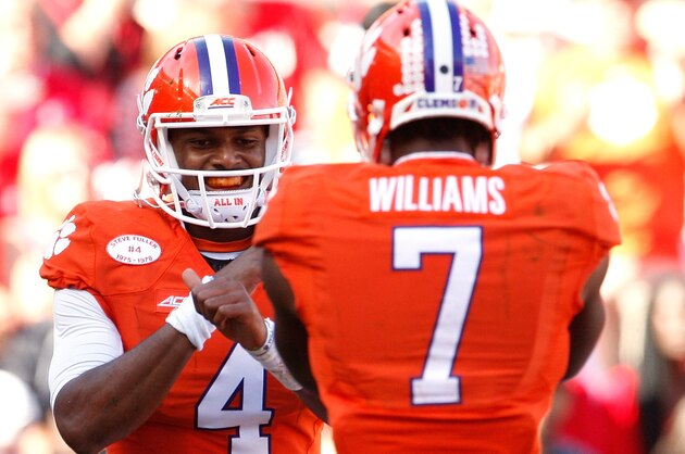 CLEMSON, SC - OCTOBER 4: Deshaun Watson #4 of the Clemson Tigers celebrates with Mike Williams #7 after Watson scored a touchdown during the game against the North Carolina State Wolfpack at Memorial Stadium on October 4, 2014 in Clemson, South Carolina. (Photo by Tyler Smith/Getty Images)