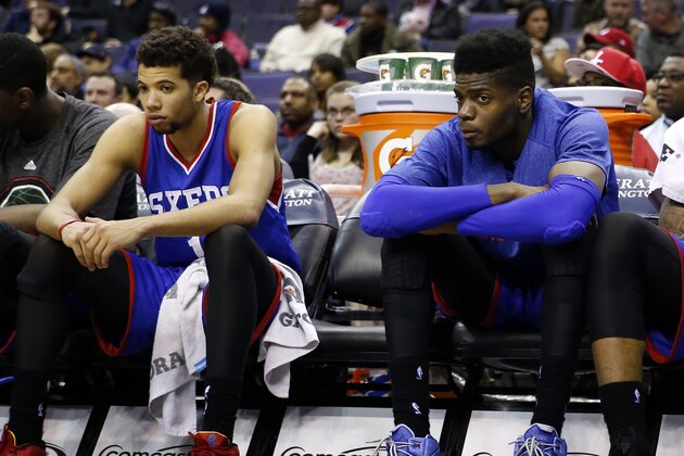 Philadelphia 76ers center Henry Sims, left, guard Michael Carter-Williams, center Nerlens Noel, forward Malcolm Thomas, and guard K.J. McDaniels sit on the bench late in the second half of an NBA basketball game against the Washington Wizards, Monday, Jan. 19, 2015, in Washington. The Wizards won 111-76. (AP Photo/Alex Brandon)