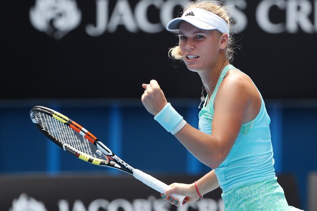 Caroline Wozniacki of Denmark celebrates after defeating Taylor Townsend of the U.S. in their first round match at the Australian Open tennis championship in Melbourne, Australia, Tuesday, Jan. 20, 2015. (AP Photo/Rob Griffith)