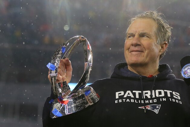 FOXBORO, MA - JANUARY 18:  Head coach Bill Belichick of the New England Patriots holds up the Lamar Hunt Trophy after defeating the Indianapolis Colts in the 2015 AFC Championship Game at Gillette Stadium on January 18, 2015 in Foxboro, Massachusetts.  The Patriots defeated the Colts 45-7.  (Photo by Elsa/Getty Images)