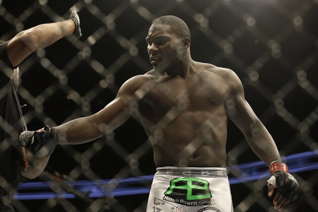 Anthony Johnson is pushed away by referee Herb Dean after beating Antonio Rogerio Nogueira by technical knockout during a light heavyweight mixed martial arts bout at a UFC on Fox event in San Jose, Calif., Saturday, July 26, 2014. Johnson won by technical knockout. (AP Photo/Jeff Chiu)