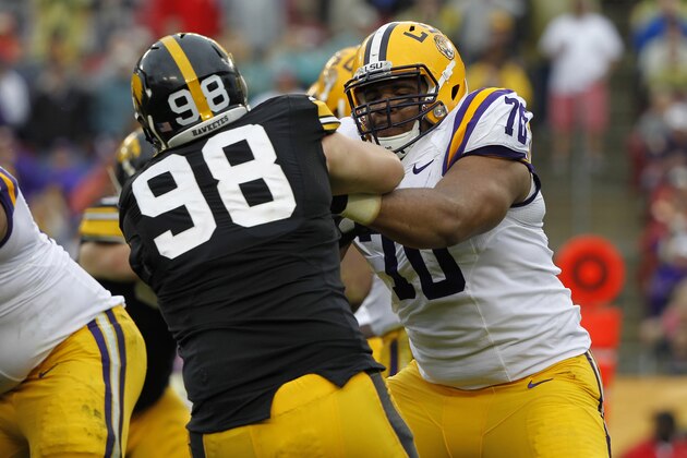 Jan 1, 2014; Tampa, Fl, USA; LSU Tigers offensive tackle La'el Collins (70) blocks as Iowa Hawkeyes defensive lineman Mike Hardy (98) rushes during the first half at Raymond James Stadium. Mandatory Credit: Kim Klement-USA TODAY Sports