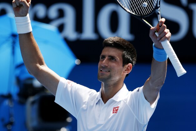 Novak Djokovic of Serbia waves to the crowd following his second round win over Andrey Kuznetsov of Russia at the Australian Open tennis championship in Melbourne, Australia, Thursday, Jan. 22, 2015. (AP Photo/Vincent Thian )