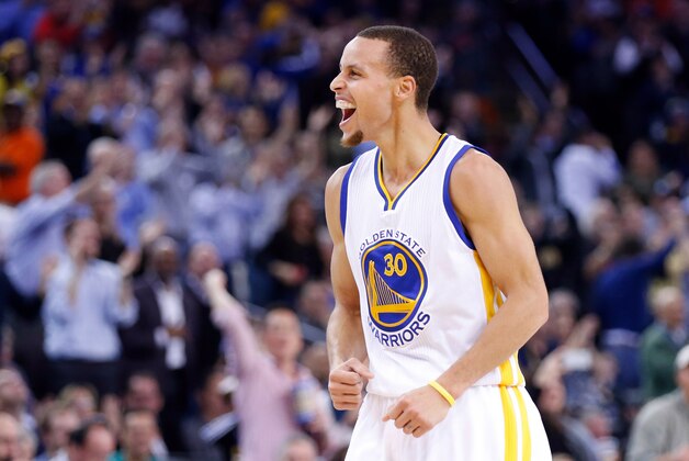 Jan 21, 2015; Oakland, CA, USA; Golden State Warriors guard Stephen Curry (30) reacts after a basket against the Houston Rockets during the second quarter at Oracle Arena. Mandatory Credit: Kelley L Cox-USA TODAY Sports