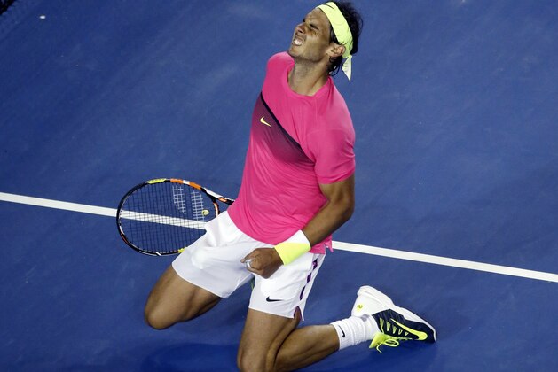 Rafael Nadal of Spain celebrates after defeating Tim Smyczek of the U.S. during their second round match at the Australian Open tennis championship in Melbourne, Australia, Wednesday, Jan. 21, 2015. (AP Photo/Vincent Thian)