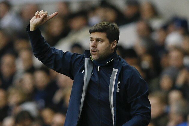 Tottenham's manager Mauricio Pochettino directs his team during the English Premier League soccer match between Tottenham Hotspur and Crystal Palace at White Hart Lane stadium in London, Saturday, Dec. 6, 2014. (AP Photo/Kirsty Wigglesworth)