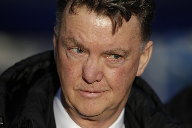 Manchester United's manager Louis van Gaal waits for the start of the English Premier League soccer match between QPR and Manchester United at Loftus Road stadium in London, Saturday, Jan. 17, 2015.  (AP Photo/Matt Dunham)