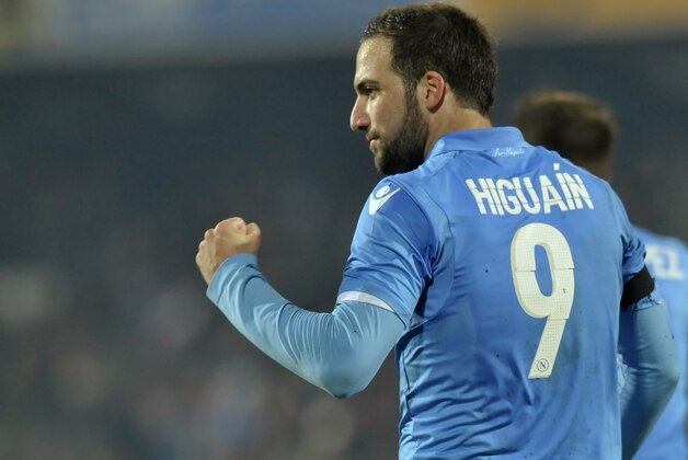 Napoli's Gonzalo Higuain celebrates after scoring a goal during the Serie A soccer match against Cesena, at Cesena's Manuzzi stadium, Italy, Tuesday, Jan 6, 2015. (AP Photo/Marco Vasini)