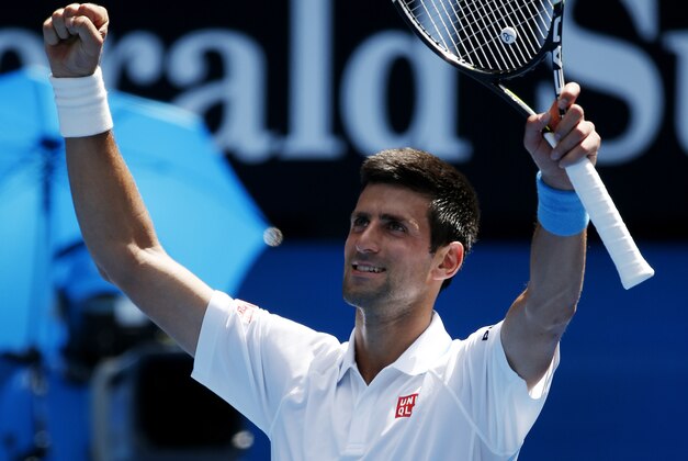 Novak Djokovic of Serbia waves to the crowd following his scone round win over Andrey Kuznetsov of Russia at the Australian Open tennis championship in Melbourne, Australia, Thursday, Jan. 22, 2015. (AP Photo/Vincent Thian )