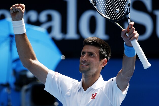 Novak Djokovic of Serbia waves to the crowd following his second round win over Andrey Kuznetsov of Russia at the Australian Open tennis championship in Melbourne, Australia, Thursday, Jan. 22, 2015. (AP Photo/Vincent Thian )