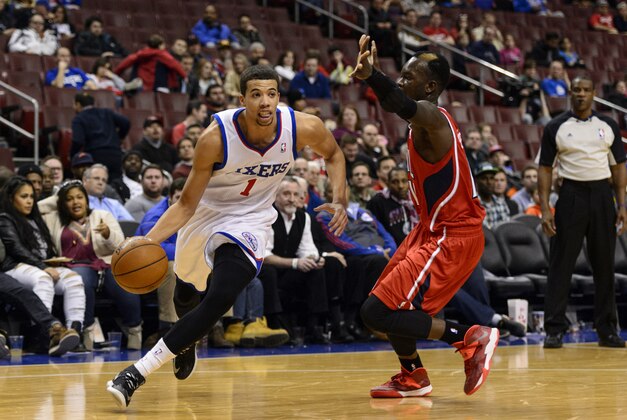 Jan 31, 2014; Philadelphia, PA, USA; Philadelphia 76ers guard Michael Carter-Williams (1) is defended by Atlanta Hawks guard Dennis Schroder (17) during the fourth quarter at the Wells Fargo Center. The Hawks defeated the Sixers 125-99. Mandatory Credit: Howard Smith-USA TODAY Sports
