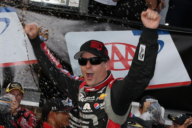 DOVER, DE - SEPTEMBER 28:  Jeff Gordon, driver of the #24 Drive To End Hunger Chevrolet, celebrates in Victory Lane after winning the NASCAR Sprint Cup Series AAA 400 at Dover International Speedway on September 28, 2014 in Dover, Delaware.  (Photo by Nick Laham/Getty Images)