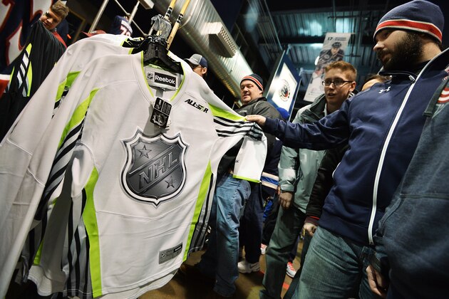 COLUMBUS, OH - JANUARY 10:   Fans look over the jerseys in the team store for the upcoming 2015 Honda NHL All Star game to be held in Columbus, Ohio before a game between the Columbus Blue Jackets and the New York Islanders on January 10, 2015 at Nationwide Arena in Columbus, Ohio.  (Photo by Jamie Sabau/NHLI via Getty Images)