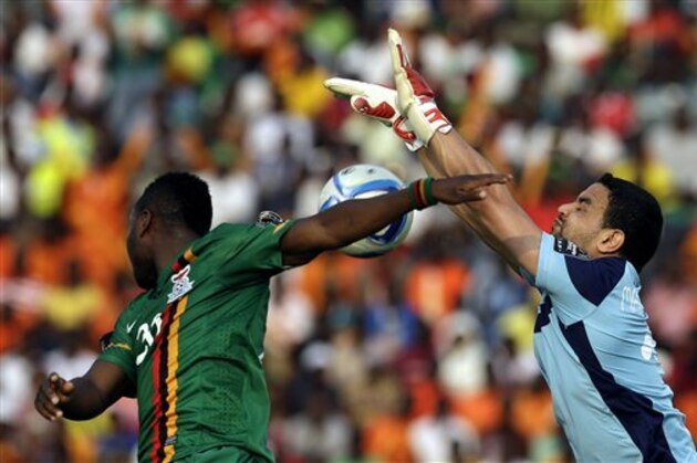 Tunisia’s goalkeeper Aymen Mathlouthi, right, is challenged by Zambia’s Emmanuel Mayuka, left, during their African Cup of Nations Group B soccer match in Ebibeyin, Equatorial Guinea, Thursday, Jan. 22, 2015. (AP Photo/Themba Hadebe)