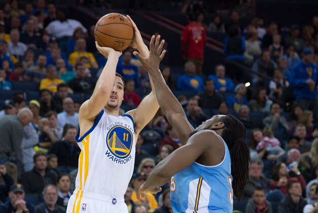 January 19, 2015; Oakland, CA, USA; Golden State Warriors guard Klay Thompson (11) shoots the basketball against Denver Nuggets forward Kenneth Faried (35) during the third quarter at Oracle Arena. The Warriors defeated the Nuggets 122-79. Mandatory Credit: Kyle Terada-USA TODAY Sports January 19, 2015; Oakland, CA, USA; Golden State Warriors guard Klay Thompson (11) shoots the basketball against Denver Nuggets forward Kenneth Faried (35) during the third quarter at Oracle Arena. The Warriors defeated the Nuggets 122-79. Mandatory Credit: Kyle Terada-USA TODAY Sports
