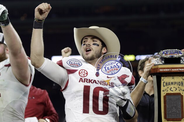 Arkansas quarterback Brandon Allen (10) cheers with fans after winning the Texas Bowl NCAA college football game against Texas Monday, Dec. 29, 2014, in Houston. Arkansas won 31-7. (AP Photo/David J. Phillip)