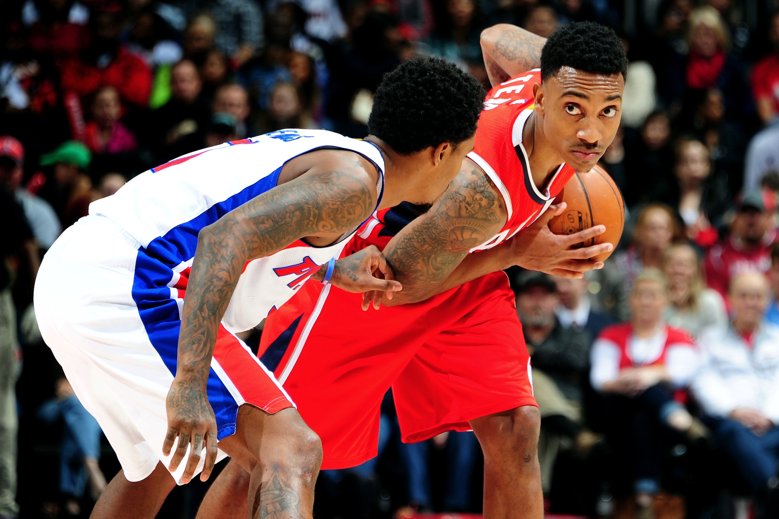 ATLANTA, GA - JANUARY 19: Jeff Teague #0 of the Atlanta Hawks looks to drive against Brandon Jennings #7 of the Detroit Pistons on January 19, 2015 at Philips Arena in Atlanta, Georgia.  NOTE TO USER: User expressly acknowledges and agrees that, by downloading and/or using this Photograph, user is consenting to the terms and conditions of the Getty Images License Agreement. Mandatory Copyright Notice: Copyright 2014 NBAE (Photo by Scott Cunningham/NBAE via Getty Images)