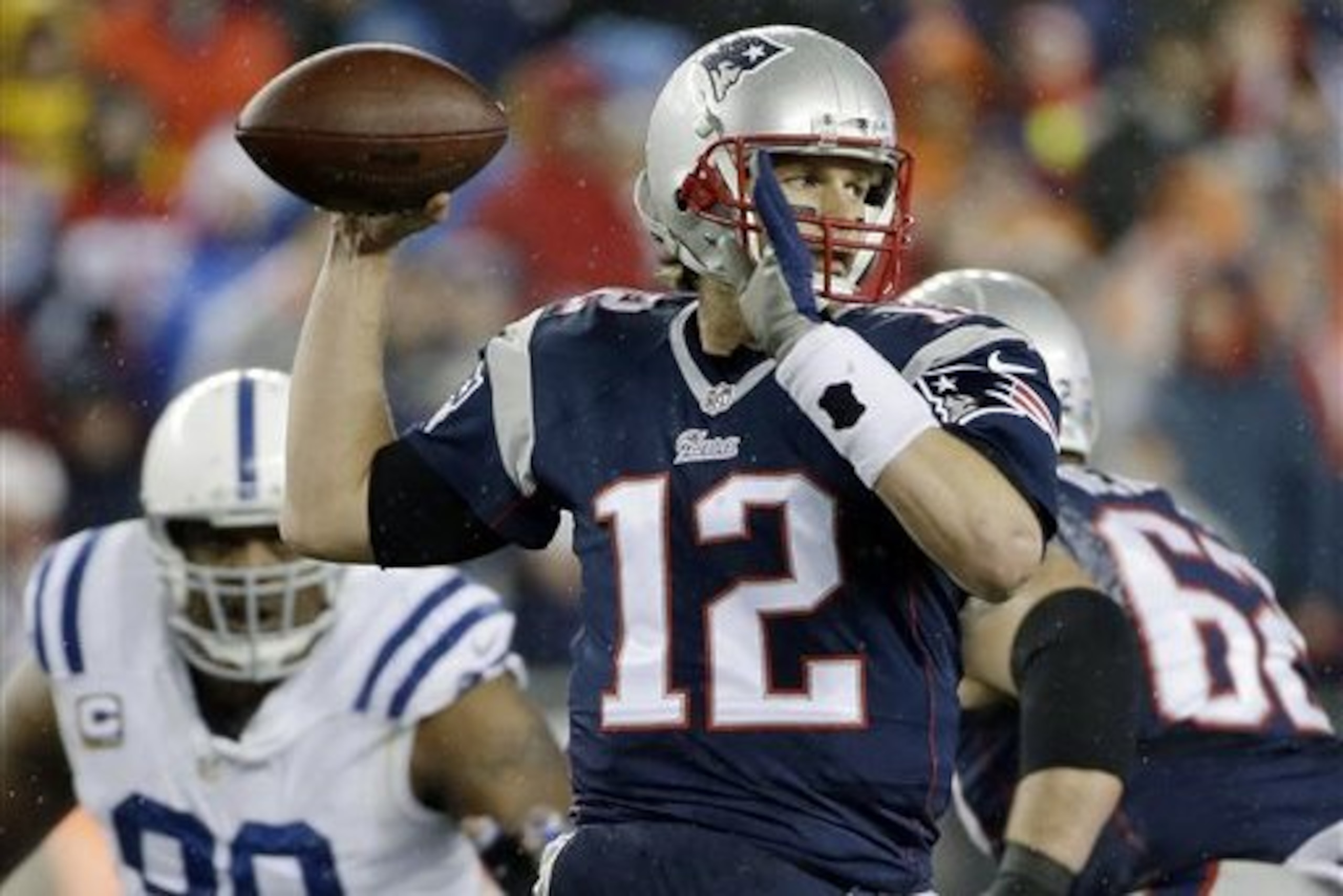 FILE - In this Jan. 18, 2015, file photo, New England Patriots quarterback Tom Brady looks to pass during the first half of the NFL football AFC Championship game against the Indianapolis Colts in Foxborough, Mass. The NFL is investigating whether the Patriots deflated footballs that were used in their AFC championship game victory over the Colts. The inquiry was first reported by the website for WTHR-TV in Indiana, citing an unnamed source. On his regular weekly morning-after-game appearance Monday, Jan. 19, 2015, on WEEI radio, Brady said he wasn't aware of the report about the league's investigation into whether footballs were properly inflated against Indianapolis. (AP Photo/Matt Slocum, File)