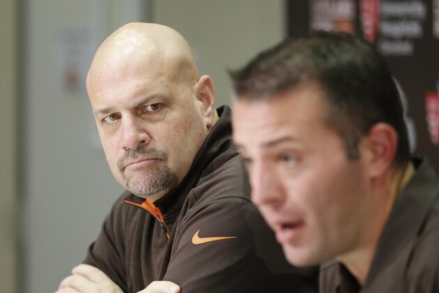 Cleveland Browns head coach Mike Pettine listens during a news conference with new offensive coordinator John DiFilippo at the NFL football team's facility in Berea, Ohio Thursday, Jan. 22, 2015. As Cleveland's new offensive coordinator, DeFilippo takes on the biggest challenge of his career with the Browns, who once again have a mess at quarterback. (AP Photo/Mark Duncan)