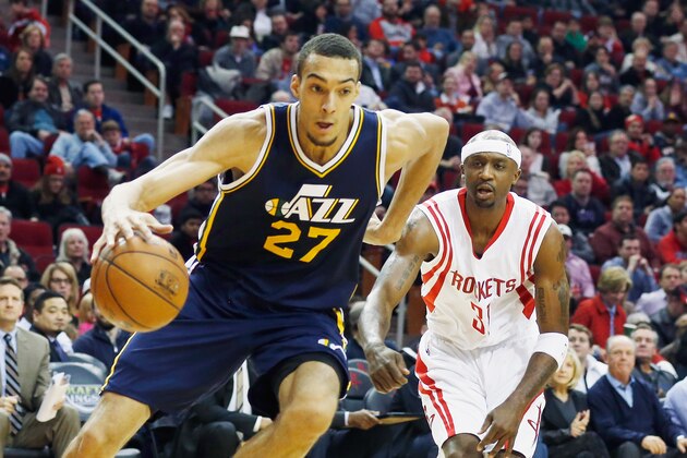 HOUSTON, TX - JANUARY 10:  Rudy Gobert #27 of the Utah Jazz drives with the basketball in front of Jason Terry #31 of the Houston Rockets during their game at the Toyota Center on January 10, 2015 in Houston, Texas.  NOTE TO USER: User expressly acknowledges and agrees that, by downloading and/or using this photograph, user is consenting to the terms and conditions of the Getty Images License Agreement.  (Photo by Scott Halleran/Getty Images)