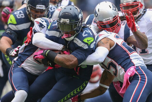 SEATTLE, WA - OCTOBER 14:  Running back Marshawn Lynch #24 of the Seattle Seahawks rushes against the New England Patriots at CenturyLink Field on October 14, 2012 in Seattle, Washington.  (Photo by Otto Greule Jr/Getty Images)