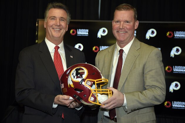 Washington Redskins president Bruce Allen, left, poses with new general manager Scot McCloughan, right, at an NFL football press conference where McCloughan was introduced as the Washington Redskins new general manager, Friday, Jan. 9, 2015, in Ashburn, Va. (AP Photo/Nick Wass)