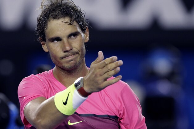 Rafael Nadal of Spain reacts after beating  Tim Smyczek of the U.S.  during their second round match at the Australian Open tennis championship in Melbourne, Australia, Wednesday, Jan. 21, 2015.AP Photo/Lee Jin-man)