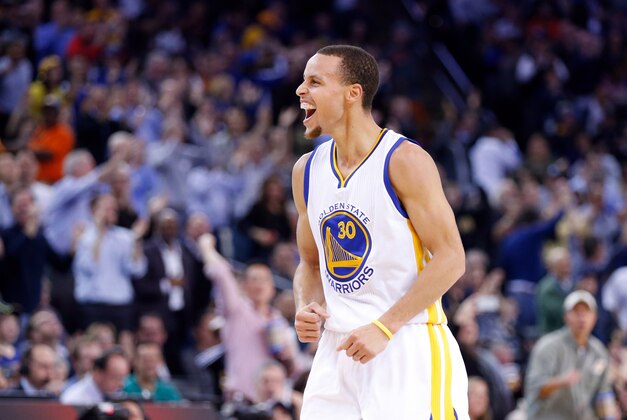 Jan 21, 2015; Oakland, CA, USA; Golden State Warriors guard Stephen Curry (30) reacts after a basket against the Houston Rockets during the second quarter at Oracle Arena. Mandatory Credit: Kelley L Cox-USA TODAY Sports