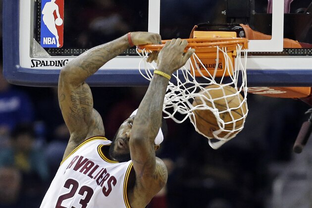 Cleveland Cavaliers' LeBron James dunks against the Utah Jazz during the second quarter of an NBA basketball game Wednesday, Jan. 21, 2015, in Cleveland. (AP Photo/Mark Duncan)
