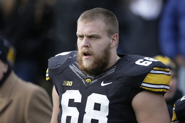 Iowa offensive lineman Brandon Scherff stands on the sidelines before an NCAA college football game against Nebraska, Friday, Nov. 28, 2014, in Iowa City, Iowa. (AP Photo/Charlie Neibergall)
