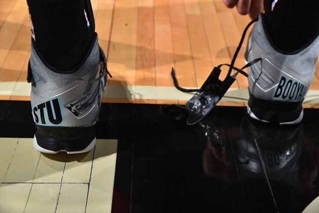 CHICAGO,IL - JANUARY 22: Danny Green #14 of the San Antonio Spurs honors Stewart Scott with custom sneakers with Stewarts catch phrases on them prior to the game against the Chicago Bulls at the United Center on January 21, 2015 in Chicago, Illinois . NOTE TO USER: User expressly acknowledges and agrees that, by downloading and/or using this Photograph, user is consenting to the terms and conditions of the Getty Images License Agreement. Mandatory Copyright Notice: Copyright 2015 NBAE (Photo by Jesse D. Garrabrant/NBAE via Getty Images)