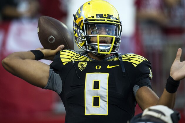Oregon quarterback Marcus Mariota throws to a receiver during warmups before the start of an NCAA college football game against Washington State on Saturday, Sept. 20, 2014, at Martin Stadium in Pullman, Wash. Oregon won 38-31. (AP Photo/Dean Hare)